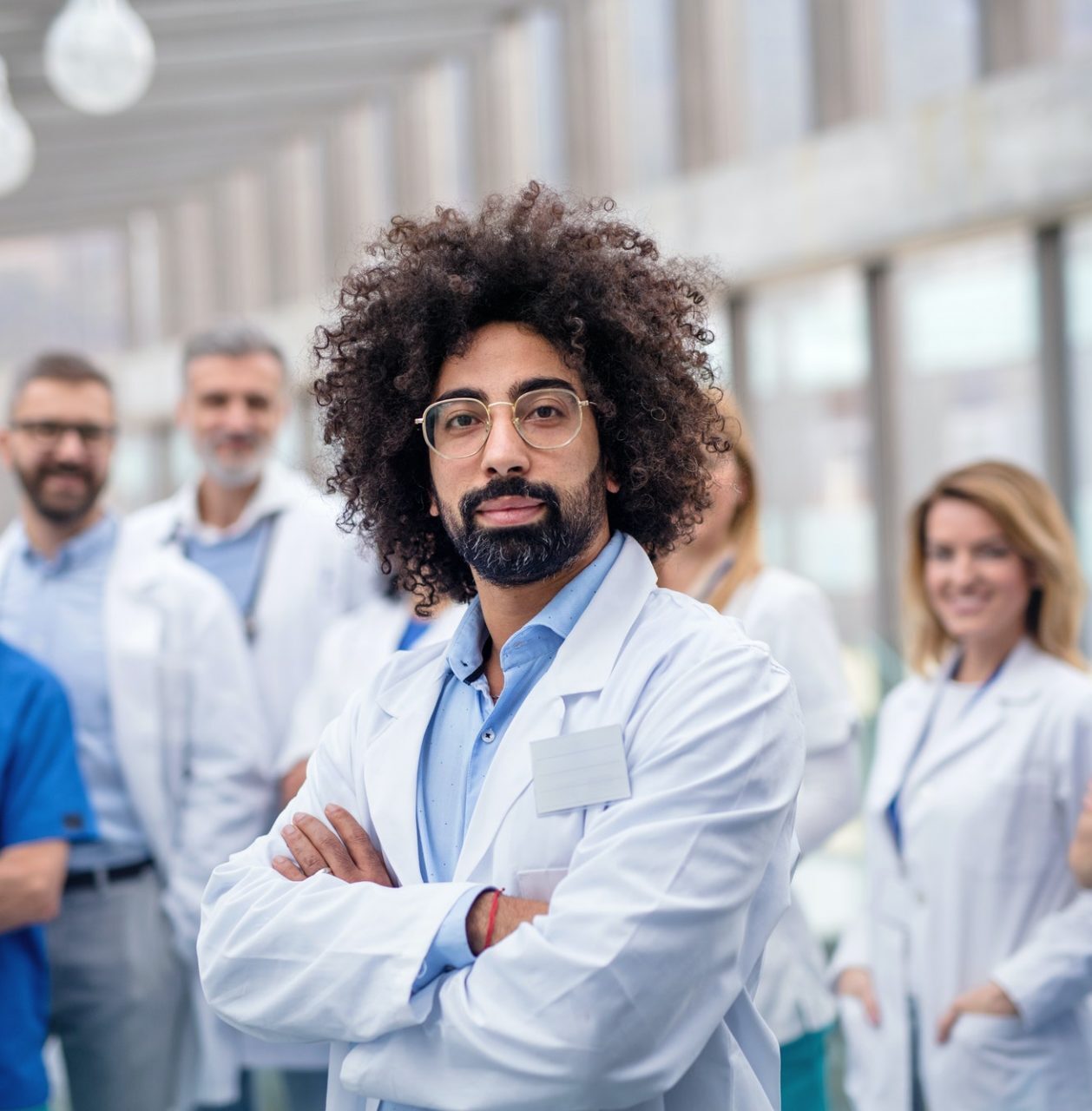 group-of-doctors-standing-in-corridor-on-medical-conference-e1623252293962.jpg